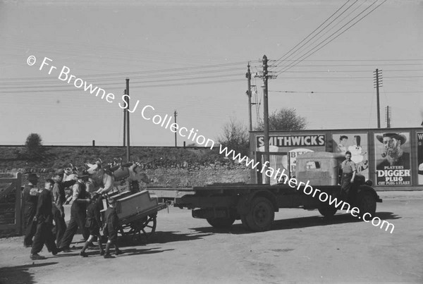 CHILDREN PUSHING CART AND MAN WITH LORRY  ADVERTISEMENTS FOR SMITHWICKS PLAWERS DIGGER PLUG TOBACCO